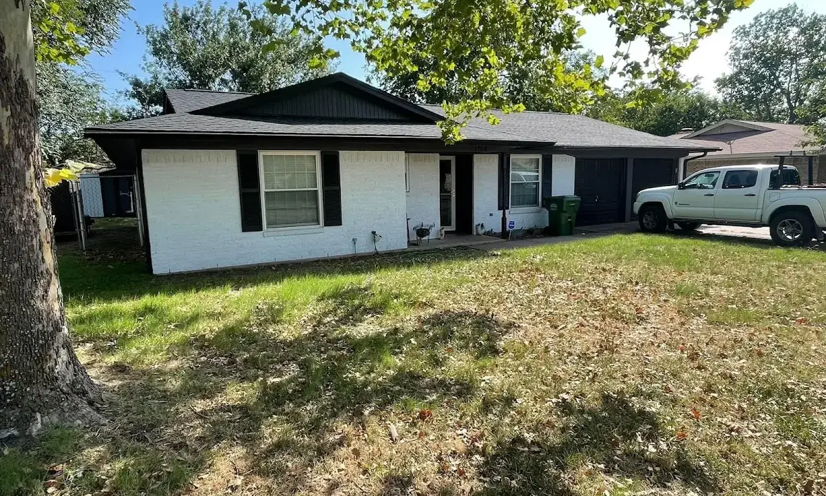 Professional roofing crew working on a residential roof in Brecksville